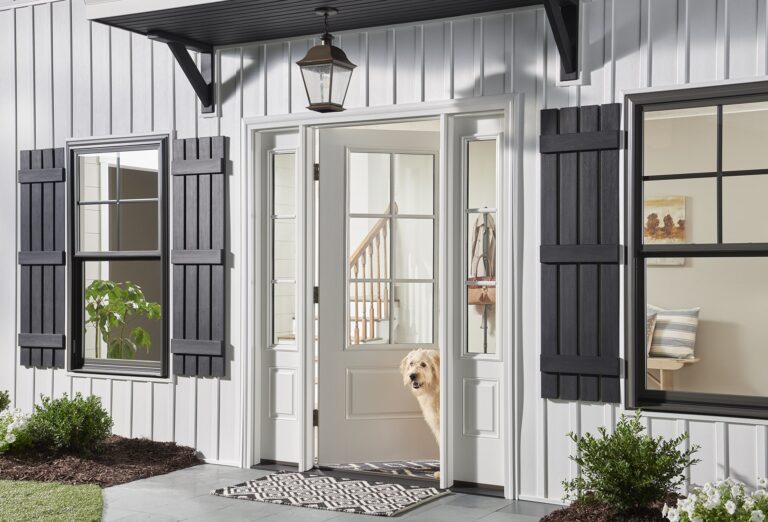 dog peeking out front door