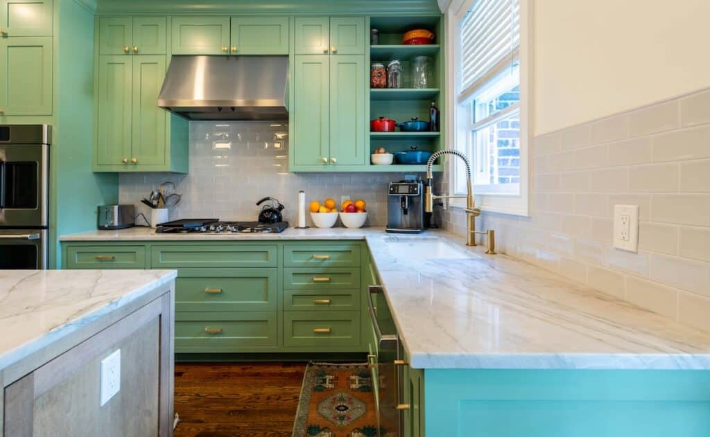 green kitchen with white vinyl window
